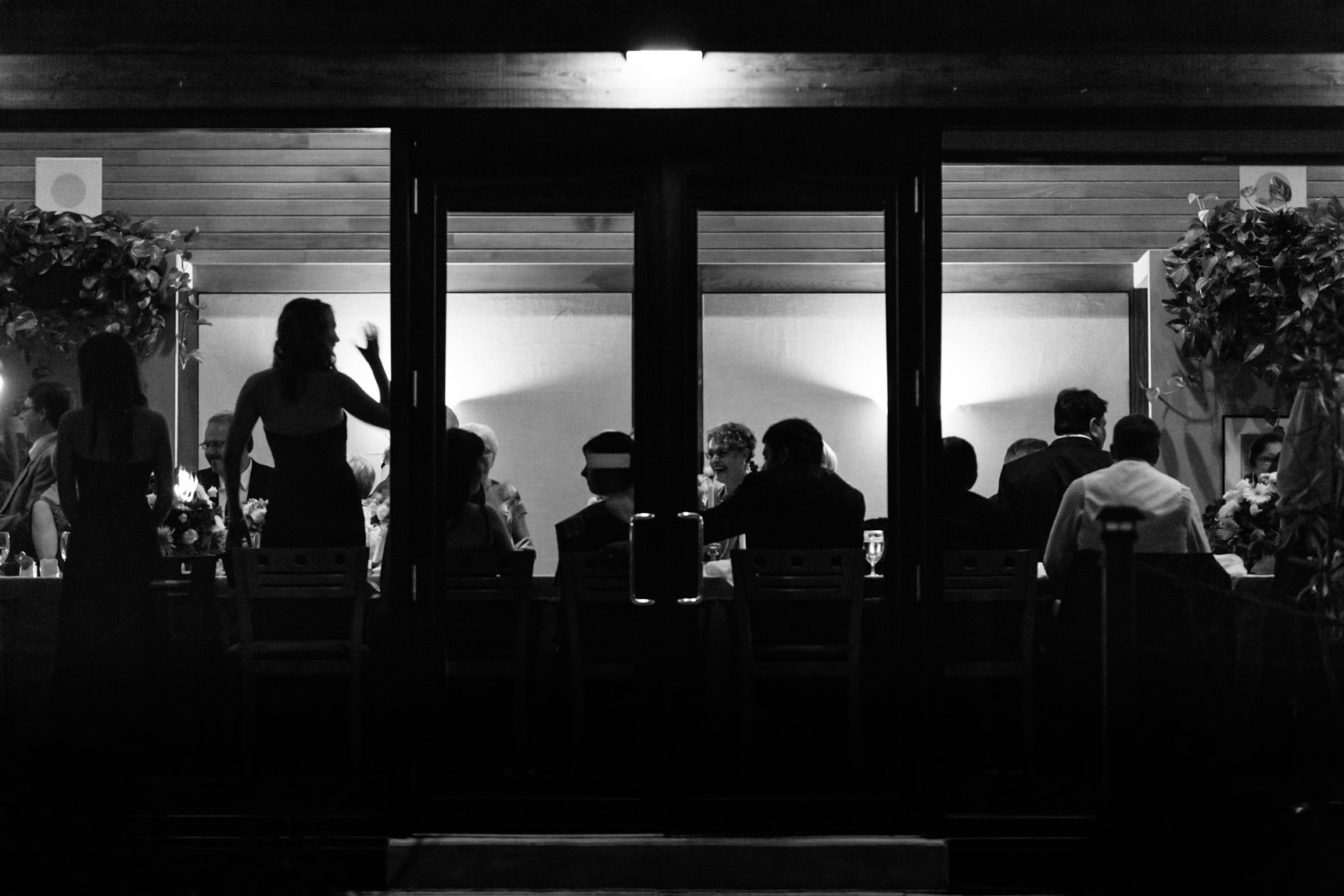Silhouettes of wedding guests from outside the Kingbridge Centre.