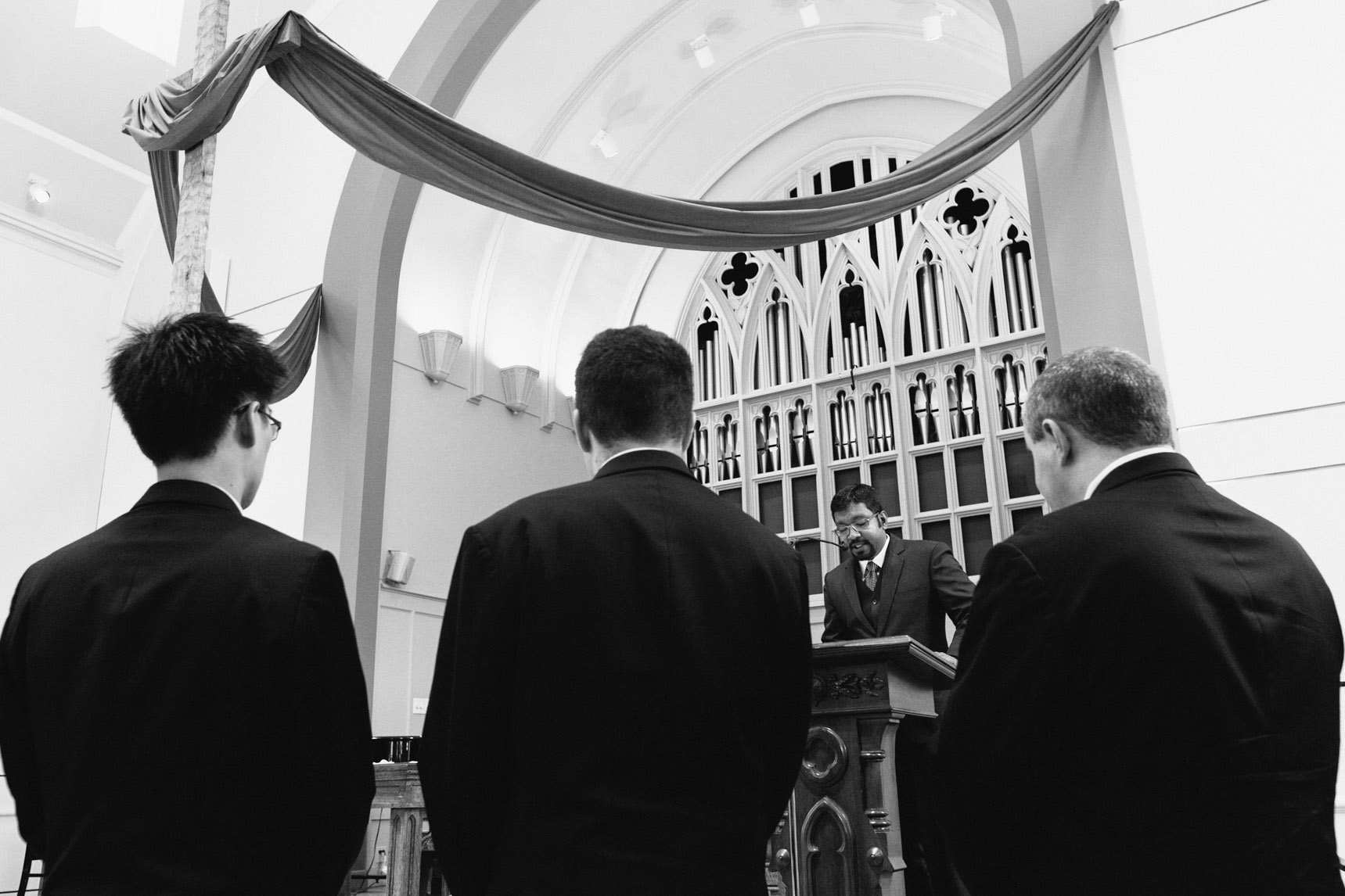 Best man delivers speech during ceremony.