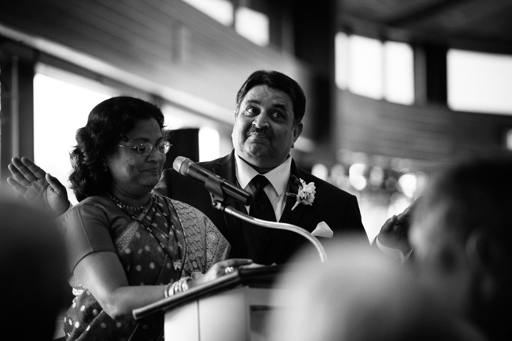 Groom's parents deliver speech during dinner reception.