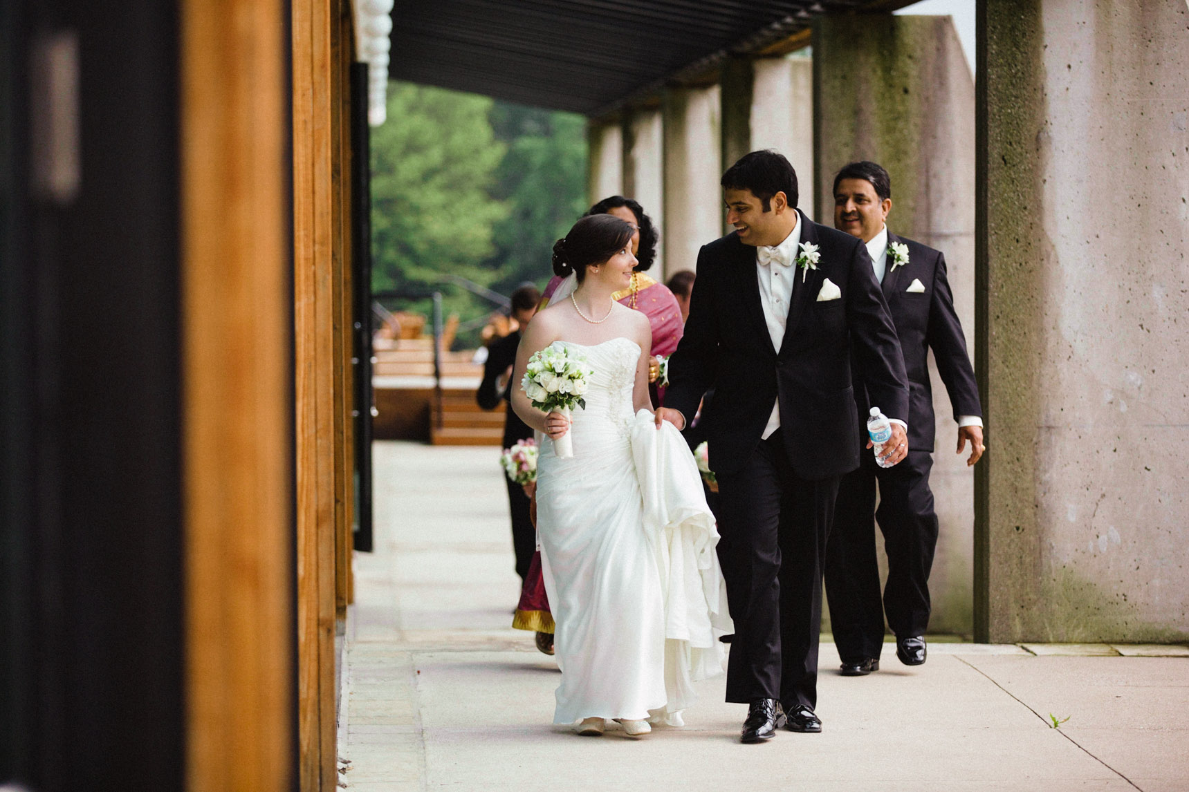 Bride and groom walk the grounds of the Kingbridge centre wedding.