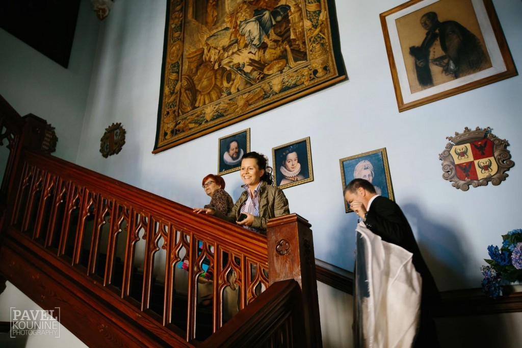 Intimate wedding photography: bride going to private suite in castle