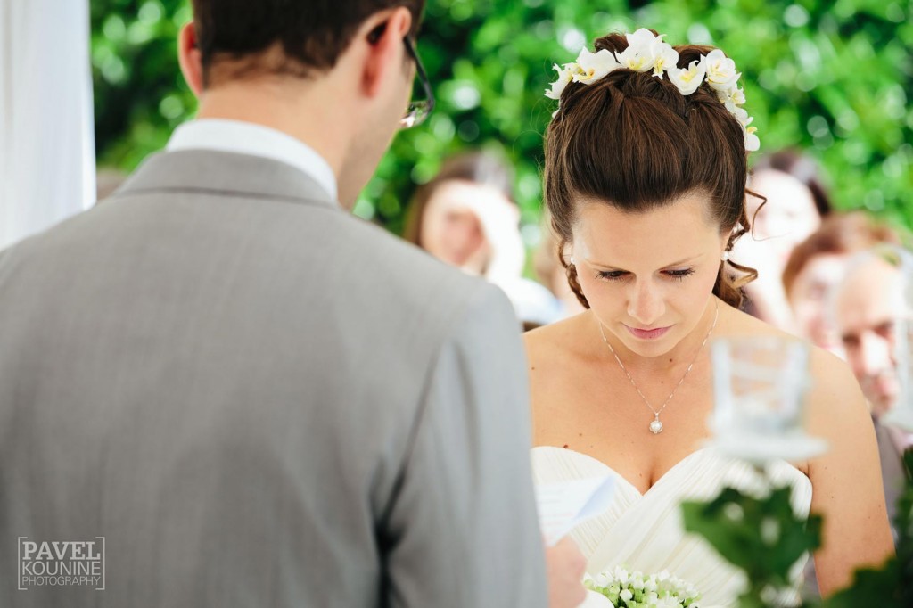 Intimate wedding photography: bride in thought during ceremony
