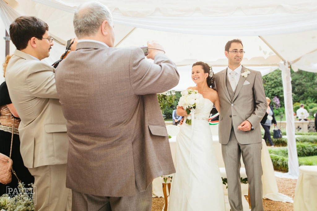 Intimate wedding photography: bride and groom pose for photography