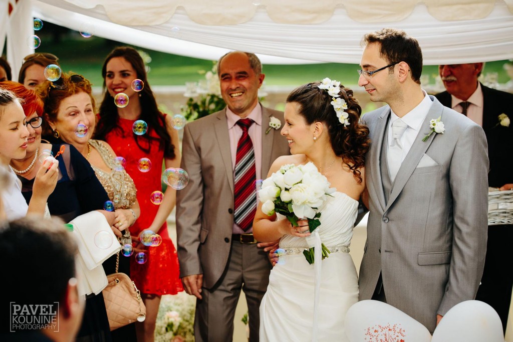 Intimate wedding photography: bride and groom pose for photographs 