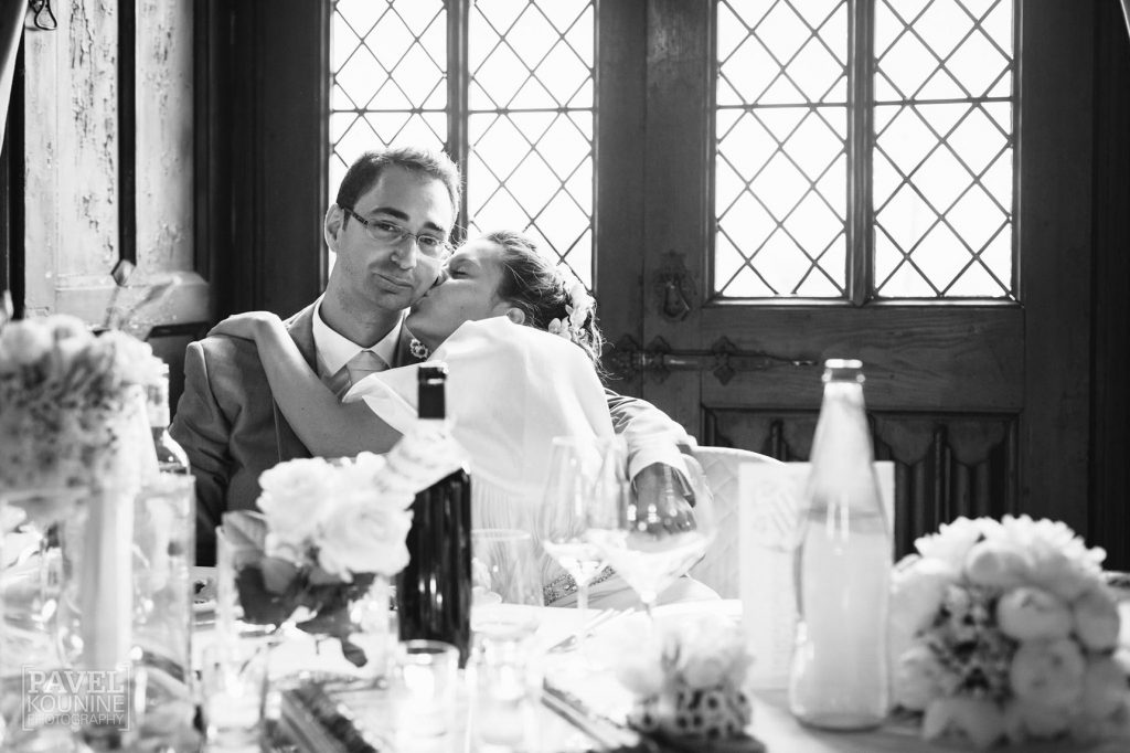 Intimate wedding photography: bride kisses groom