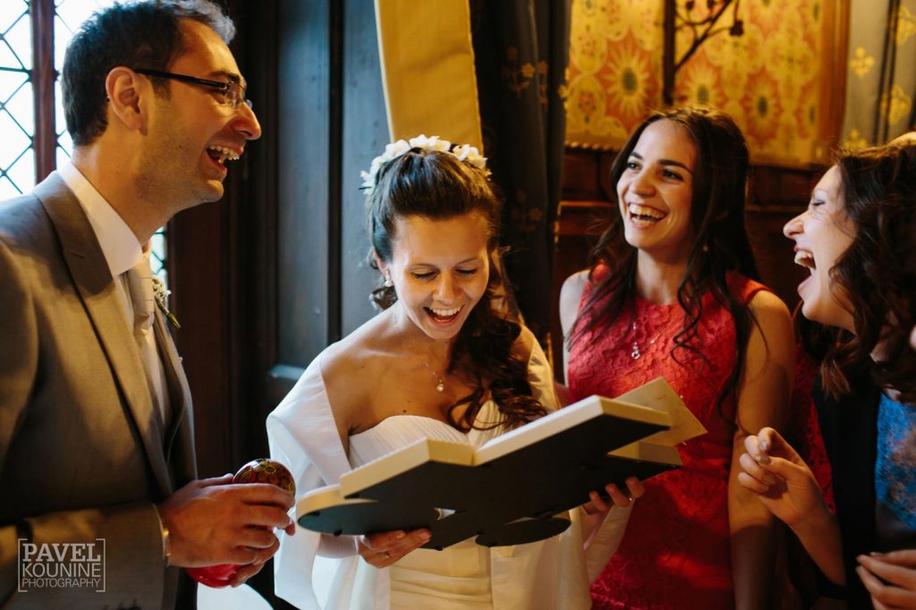 Intimate wedding photography: bride and groom are showered with gifts
