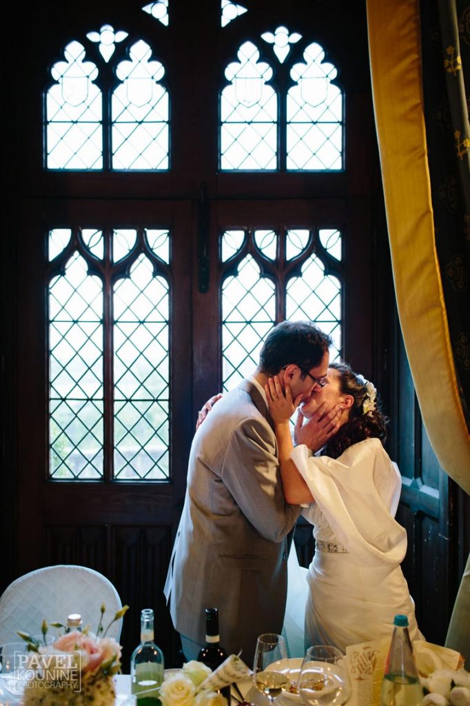 Intimate wedding photography: bride and groom share a kiss